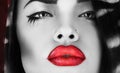 Horizontal photo of black and white female with red lips