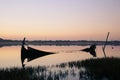 Broken down and sunken boat close to the shore of the Aveiro Lagoon, on a sunset.