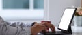 Businessman hands typing on keyboard of tablet computer at his workspace. Royalty Free Stock Photo