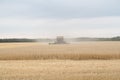 Combining a farm field under a cloudy sky Royalty Free Stock Photo