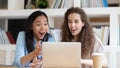 Horizontal photo excited surprised diverse girls looking at laptop screen