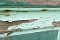 Horizontal photo of old wood with chipped peeling teal paint