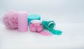 Horizontal photo of personal care, shower and spa items on the white background. Shower sponge, candle and bath salt in