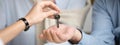 Horizontal photo couple receiving keys to new home from agent