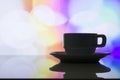 Horizontal photo of silhouette coffee cup on colorful bokeh back