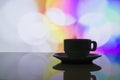 Horizontal photo of silhouette coffee cup on colorful bokeh back