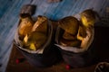 Couple of worn cans with fried potato stripes on chopping board Royalty Free Stock Photo