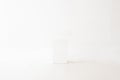 Minimalist Horizontal View of a Small Blank White Box Centered Against a Clean White Studio Background Royalty Free Stock Photo