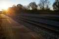 Long Empty Railroad Tracks at Sunset