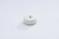 White Powdered Sugar Donut on a White Background