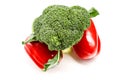 Green broccoli and two red juicy peppers on a white background Royalty Free Stock Photo