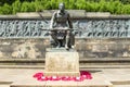 Horizontal picture of the call statue with soldiers in background