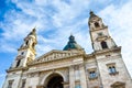 Horizontal picture of the front side facade of Saint Stephen`s Basilica in Budapest, Hungary with blue sky and clouds above.Roman Royalty Free Stock Photo