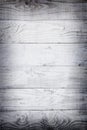 Horizontal planks of white painted worn part of fence or door