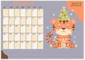 Planner calendar template for December 2022. Cute tiger with Christmas tree, toys and garlands. Year of the Tiger in