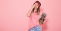 Portrait of a girl with a closed eye on a pink background Royalty Free Stock Photo