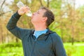 Horizontal portrait of a man drinking water from a bottle Royalty Free Stock Photo