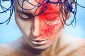 Horizontal portrait of woman with neon powder on face in st Royalty Free Stock Photo