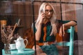 Horizontal portrait of young blonde business woman talking