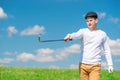 Horizontal portrait of a sportsman on a game of golf