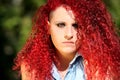 Horizontal portrait of a young girl with red curly hair