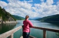 Backpacking at dam Vidraru Lake in Romania Royalty Free Stock Photo