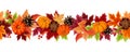 Horizontal seamless background with pumpkins and colorful autumn leaves. Vector illustration. Royalty Free Stock Photo