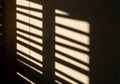Horizontal shadows of wooden blinds fall Royalty Free Stock Photo