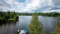 Horizontal shot of a beautiful lake near the Laurentian Mountains in Quebec, Canada Royalty Free Stock Photo