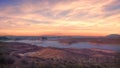 Horizontal shot of the beautiful Lake Powell under the breathtaking fire-like clouds, in the USA