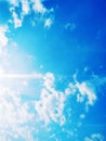 A horizontal shot of bright blue sky with puffy white clouds. Royalty Free Stock Photo