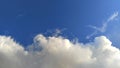 A horizontal shot of bright blue sky with puffy white clouds.sky view Royalty Free Stock Photo