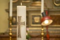 Detail of an Easter candle lit in the church.