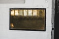 Horizontal shot of a empty brass plate on white brick wall Royalty Free Stock Photo