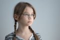 Horizontal shot of a Girl teenager with glasses and two braids. Portrait of the blonde girl Royalty Free Stock Photo