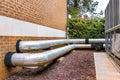 HVAC Pipes Between Outdoor AC Units and Residential Complex