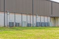 Multiple Commercial Air Conditioners Behind Retail Strip Center