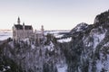 A horizontal shot of Neuschwanstein castle in winter at sunrise, Germany Royalty Free Stock Photo