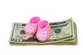 Pink Girl Booties on a Stack of Money Royalty Free Stock Photo