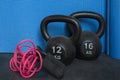 Two cast-iron kettlebells, of 12 and 16 kg, and skipping rope