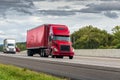 Red Semi Tractor-Trailer Travels The Interstate Highway Royalty Free Stock Photo