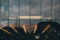 Horizontal shot of the reflection of street lights from the windows of a building during nighttime