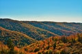 Horizontal shot of scenic hills and trees with colorful autumn foliage, nature in fall Royalty Free Stock Photo