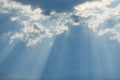 Cloudy stormy sky with sun ray breaking through. Royalty Free Stock Photo