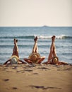 Horizontal shot of three young women in straw hats on a beach, with legs up. Blue sea in the background. Summer vacation concept Royalty Free Stock Photo
