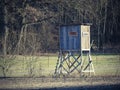 Horizontal shot of a wooden hunting lookout tower in the forest