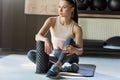 Horizontal shot of young woman relaxing after stretching exercises at the gym. Athletic girl in the gym doing pilates exercise on Royalty Free Stock Photo