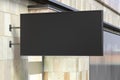 Horizontal signboard or signage on the black wall with blank luminescent sign mock up. Side view Royalty Free Stock Photo