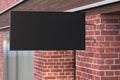 Horizontal signboard or signage on the black wall with blank luminescent sign mock up. Side view Royalty Free Stock Photo