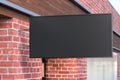 Horizontal signboard or signage on the black wall with blank luminescent sign mock up. Side view Royalty Free Stock Photo